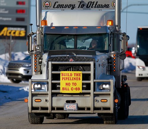 PHIL HOSSACK / WINNIPEG FREE PRESS - A convoy of pipeline supporters heads through the city with a couple of dozen (maybe) trucks pickups and cars headed to Ottawa in protest of the Liberal Government policies. February 15, 2019