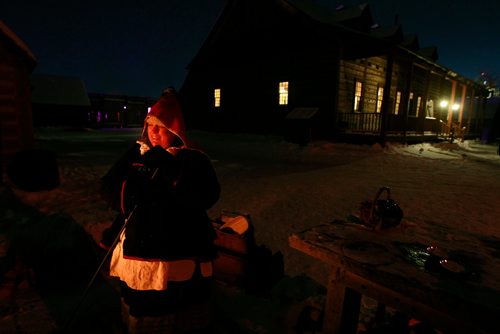 PHIL HOSSACK / WINNIPEG FREE PRESS -  Appropriately named, Kiri Butter bakes shortbread basking in the glow from her outdoor traditional brick and stone stove at Fort Gibralter Friday night.She'll be baking breads and more all week long at the 50th Festival du Voyageur celebrations.February 15, 2019