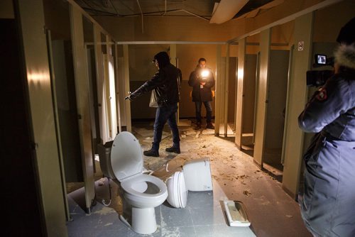 MIKE DEAL / WINNIPEG FREE PRESS
Bear Clan Patrol co-founder James Favel takes media on a tour of the Indian and Métis Friendship Centre the morning after a Bear Clan Patrol noticed that one of the buildings doors was open. When they entered they discovered it had been robbed and gutted. The building had been closed and without power some time.
This is the women's bathroom.
190216 - Saturday, February 16, 2019.