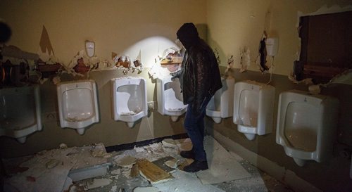 MIKE DEAL / WINNIPEG FREE PRESS
Bear Clan Patrol co-founder James Favel takes media on a tour of the Indian and Métis Friendship Centre the morning after a Bear Clan Patrol noticed that one of the buildings doors was open. When they entered they discovered it had been robbed and gutted. The building had been closed and without power some time.
This is the men's bathroom.
190216 - Saturday, February 16, 2019.