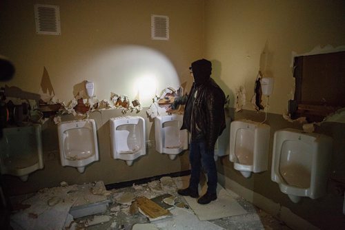 MIKE DEAL / WINNIPEG FREE PRESS
Bear Clan Patrol co-founder James Favel takes media on a tour of the Indian and Métis Friendship Centre the morning after a Bear Clan Patrol noticed that one of the buildings doors was open. When they entered they discovered it had been robbed and gutted. The building had been closed and without power some time.
This is the men's bathroom.
190216 - Saturday, February 16, 2019.