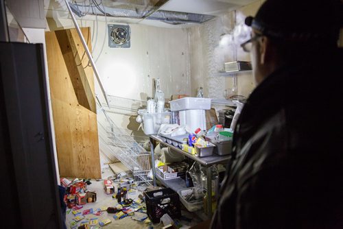 MIKE DEAL / WINNIPEG FREE PRESS
Bear Clan Patrol co-founder James Favel takes media on a tour of the Indian and Métis Friendship Centre the morning after a Bear Clan Patrol noticed that one of the buildings doors was open. When they entered they discovered it had been robbed and gutted. The building had been closed and without power some time.
Food was scattered all over the kitchen.
190216 - Saturday, February 16, 2019.