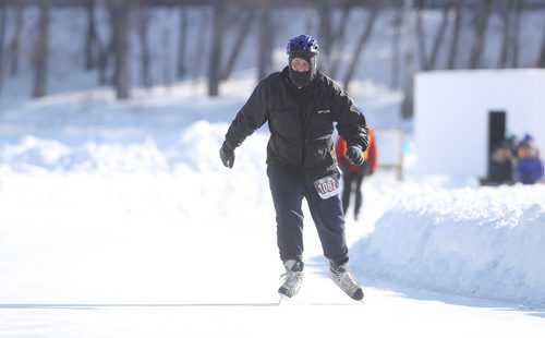TREVOR HAGAN/ WINNIPEG PRESS
Edward Friesen, originally from Belize, skating toward the finish line as the last person to complete the Beat the Cold Winter Triathlon, at the Forks, in support of 1JustCity, Sunday, February 17, 2019.