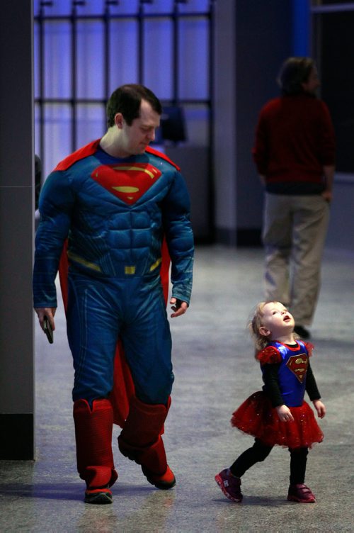 PHIL HOSSACK / WINNIPEG FREE PRESS - STAND-UP -"Look Up....It's a Plane it's a rocket it's....Superkid (and Dad)".  Out looking for peoplke to help, Devon (didn't give his last name) and Jewel (2yrs) were dressed as their favorite superhero's for the Manitoba Moose game and "Super Hero Day" at Bell MTS Centre Monday. The Moose prevailed over the visiting Milwaukee Admirals without any help.  - February 18, 2019