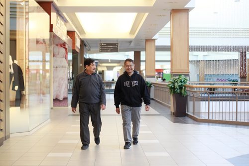MIKAELA MACKENZIE / WINNIPEG FREE PRESS
Bill Polvorosa (left) and Armand Tesoro walk at Polo Park before the shops open in Winnipeg on Tuesday, Feb. 19, 2019.
Winnipeg Free Press 2019.