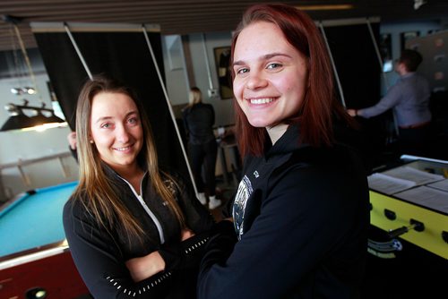PHIL HOSSACK / WINNIPEG FREE PRESS - BISONS PRESSER - Taylor Allen Story - Volleyball athlete  Cassie Bujan (left) poses with her hockey equivalent Erica Rieder (right) at morning newser for the two teams heading into the post season. February 19, 2019
