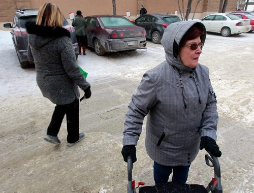 PHIL HOSSACK / WINNIPEG FREE PRESS - Local resident Beth Derraugh on her way to the Osborne Village's Shoppers Drug Mart which will no longer be open 24hrs, instead will start closing at Midnight in April. Carol Sanders' story. February 20, 2019