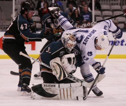 Manitoba Moose goaltender Corey Schneider makes a save as the Toronto Marlies' Andre Deveaux is pushed by the Moose's Zack FitzGerald during the third period of AHL playoff action at the Ricoh Centre in Toronto, ON Thursday, April 23, 2009. Darren Calabrese for The Winnipeg Free Press