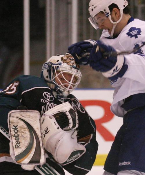 Manitoba Moose goaltender Corey Schneider makes a save as the Toronto Marlies' Darryl Boyce looks for a rebound during the first period of AHL playoff action at the Ricoh Centre in Toronto, ON Thursday, April 23, 2009. Darren Calabrese for The Winnipeg Free Press