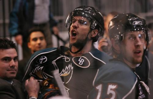 The Manitoba Moose's Nolan Baumgartner, centre, is restrained by teammates while screams during an altercation with fans following the Moose's playoff win over the Toronto Marlies at the Ricoh Centre in Toronto, ON Thursday, April 23, 2009. Darren Calabrese for The Winnipeg Free Press