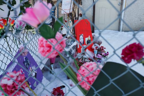 MIKE DEAL / WINNIPEG FREE PRESS
A memorial takes up a corner of the yard of a house on Ross Avenue where Autumn Prince, 18, was found curled in the fetal position on the morning of Tuesday, February 19.
190222 - Friday, February 22, 2019.