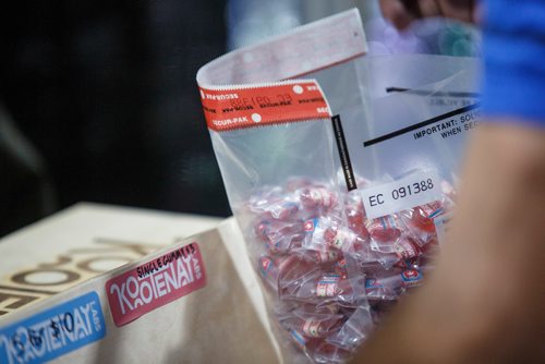 MIKE DEAL / WINNIPEG FREE PRESS
Investigators pack up illegal edible products that contain THC in the Kootenay Labs Booth at the Hempfest Canada Expo at the RBC Convention centre Saturday afternoon.
190223 - Saturday, February 23, 2019.