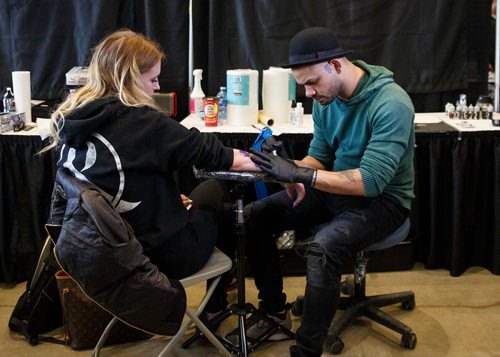 MIKE DEAL / WINNIPEG FREE PRESS
Sydney Breckman-Antony gets a tattoo by Babiery Hernandez an award winning tattoo artist based in Westchester, NY, who was a contestant on the TV Show, Ink Master.
Hundreds mingle and browse while others get tattooed by some of the best artists during the Winnipeg Tattoo Show at the RBC Convention centre Saturday afternoon.
190223 - Saturday, February 23, 2019.