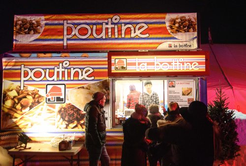 Mike Sudoma / Winnipeg Free Press
Despite there being food inside the numerous heated tents at Festival Du Voyageur, festival goers still braved the cold to get their beaver tails and poutine Friday evening. February 22, 2019