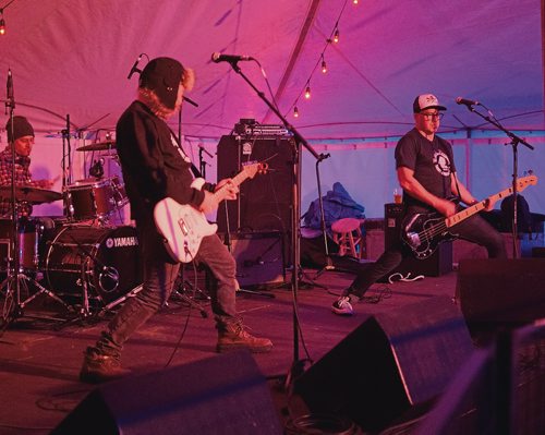 Canstar Community News Feb. 17, 2019 - Ace Burpee (right) performs with his band Golden Boys in the Forest Tent on Sunday night of Festival du Voyageur. The band is rounded out by Mark Morris and Sean Dilworth. (DANIELLE DA SILVA/SOUWESTER/CANSTAR)