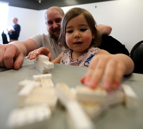 TREVOR HAGAN / WINNIPEG FREE PRESS
Billy Martens and his daughter, Shirley, 2, at the Manitoba LEGO Club block party, for Dave Sanderson, Sunday, February 24, 2019.