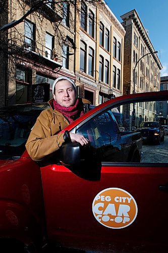 PHIL HOSSACK / WINNIPEG FREE PRESS - Philip Mikulec, operations manager of Peg City Co-op poses with one of their vehicles parked in the change district Wednesday. See story. - February 27, 2019.