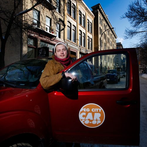 PHIL HOSSACK / WINNIPEG FREE PRESS - Philip Mikulec, operations manager of Peg City Co-op poses with one of their vehicles parked in the change district Wednesday. See story. - February 27, 2019.