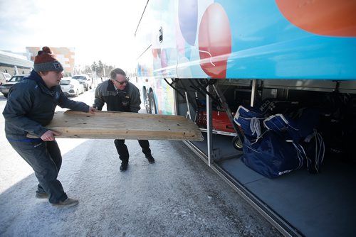 JOHN WOODS / WINNIPEG FREE PRESS
Roger Hamelin, a bus driver with Beaver Bus Lines, helps load Steinbach Pistons hockey gear onto his bus that he will driving to Waywayseecappo and back Sunday, February 24, 2019. Hamelin drove from Winnipeg to Steinbach to pick up the Steinbach Pistons and then onto Waywayseecappo where they played the Waywayseecappo Wolverines and then back to Winnipeg in what turned out to be an eighteen hour day.