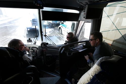 JOHN WOODS / WINNIPEG FREE PRESS
Roger Hamelin, a bus driver with Beaver Bus Lines, and Paul Dyck, coach of the Steinbach Pistons get advice from another bus driver as they wait for 3.5 hours in Headingley for the road to open so he can drive his bus  to Waywayseecappo and back Sunday, February 24, 2019. Hamelin drove from Winnipeg to Steinbach to pick up the Steinbach Pistons and then onto Waywayseecappo where they played the Waywayseecappo Wolverines and then back to Winnipeg in what turned out to be an eighteen hour day.