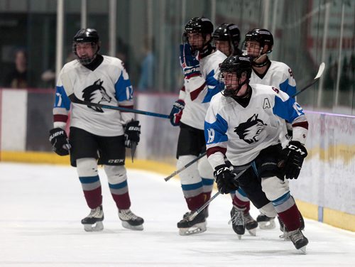 PHIL HOSSACK / WINNIPEG FREE PRESS - Sturgeon Heights Huskies' #19 Ryan Ostermann celebrates with his team mates after scoring the winning goal against the Garden City Gophers in the High School Championship game Wednesday.  See Mike Sawatzky story. - February 27, 2019.