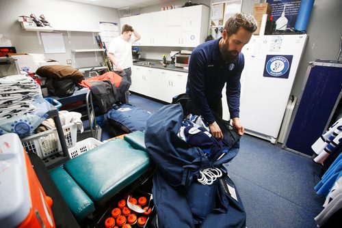 JOHN WOODS / WINNIPEG FREE PRESS
Steinbach Pistons trainer Jeff Eidse, right, and Ryan Dyck, equipment manager, pack up for the bus ride to  Waywayseecappo and back Sunday, February 24, 2019. Steinbach Pistons hit the road on a bus to Waywayseecappo where they played the Waywayseecappo Wolverines and then returned to Steinbach for a 17.5 hour day.