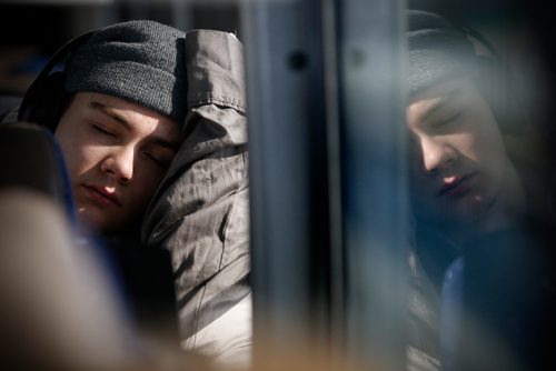 JOHN WOODS / WINNIPEG FREE PRESS
Steinbach Pistons player sleeps during the bus ride to  Waywayseecappo Sunday, February 24, 2019. Steinbach Pistons hit the road on a bus to Waywayseecappo where they played the Waywayseecappo Wolverines and then returned to Steinbach for a 17.5 hour day.