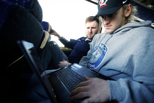 JOHN WOODS / WINNIPEG FREE PRESS
Steinbach Pistons assistant coach Calvin Bugyik, left, and forward Troy Beauchemin go over game film during the bus ride to  Waywayseecappo Sunday, February 24, 2019. Steinbach Pistons hit the road on a bus to Waywayseecappo where they played the Waywayseecappo Wolverines and then returned to Steinbach for a 17.5 hour day.


