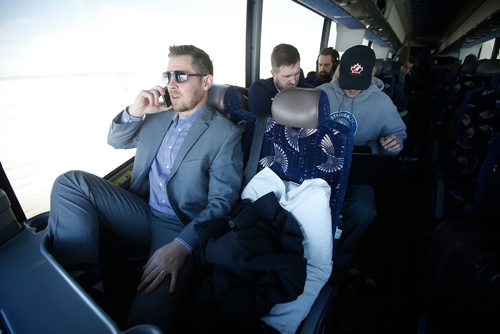 JOHN WOODS / WINNIPEG FREE PRESS
Steinbach Pistons head coach Paul Dyck talks on the phone as assistant coach Calvin Bugyik, left, and forward Troy Beauchemin go over game film during the bus ride to  Waywayseecappo Sunday, February 24, 2019. Steinbach Pistons hit the road on a bus to Waywayseecappo where they played the Waywayseecappo Wolverines and then returned to Steinbach for a 17.5 hour day.


