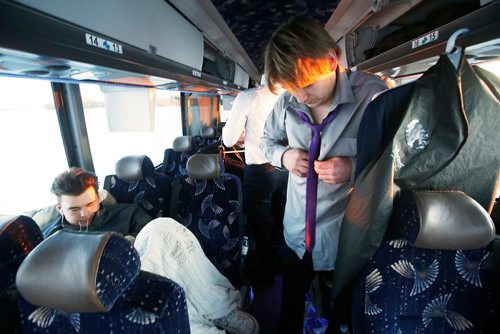 JOHN WOODS / WINNIPEG FREE PRESS
Steinbach Pistons defenceman Burke Heide and other players start putting their dress clothes on about 10 mins outside of town during the bus ride to Waywayseecappo and back Sunday, February 24, 2019. Steinbach Pistons hit the road on a bus to Waywayseecappo where they played the Waywayseecappo Wolverines and then returned to Steinbach for a 17.5 hour day.