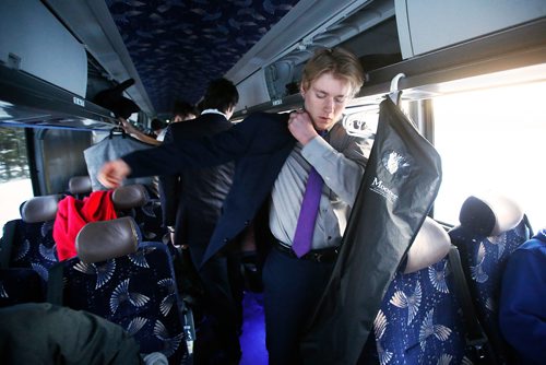 JOHN WOODS / WINNIPEG FREE PRESS
Steinbach Pistons defenceman Burke Heide and other players start putting their dress clothes on about 10 mins outside of town during the bus ride to Waywayseecappo and back Sunday, February 24, 2019. Steinbach Pistons hit the road on a bus to Waywayseecappo where they played the Waywayseecappo Wolverines and then returned to Steinbach for a 17.5 hour day.