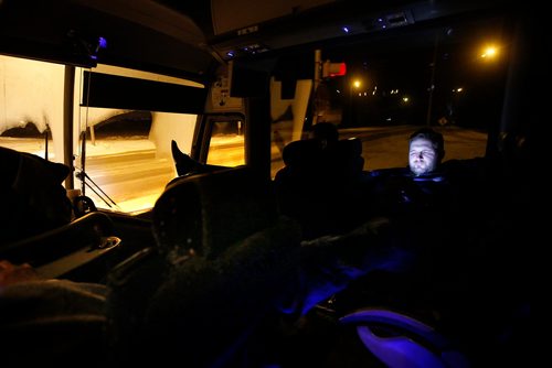 JOHN WOODS / WINNIPEG FREE PRESS
Steinbach Pistons assistant coach Calvin Bugyik watches a show on his computer on the bus as they head home after losing in Waywayseecappo and back Sunday, February 24, 2019. Steinbach Pistons hit the road on a bus to Waywayseecappo where they played the Waywayseecappo Wolverines and then returned to Steinbach for a 17.5 hour day.