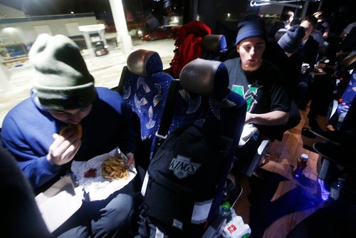 JOHN WOODS / WINNIPEG FREE PRESS
Steinbach Pistons eat their after game meal on the bus after losing in Waywayseecappo Sunday, February 24, 2019. Steinbach Pistons hit the road on a bus to Waywayseecappo where they played the Waywayseecappo Wolverines and then returned to Steinbach for a 17.5 hour day.