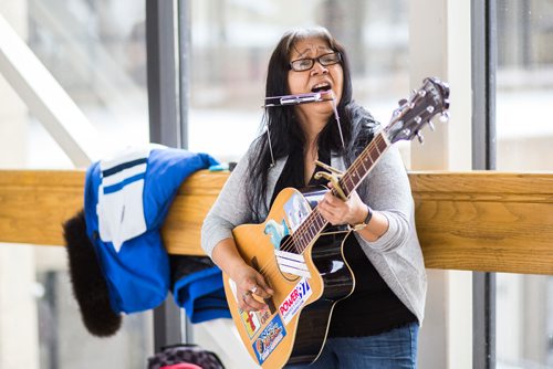 MIKAELA MACKENZIE / WINNIPEG FREE PRESS
Inuit musician Anita Issaluk plays guitar, harmonica, and sings in the skywalks downtown in Winnipeg on Wednesday, Feb. 27, 2019.
Winnipeg Free Press 2019.