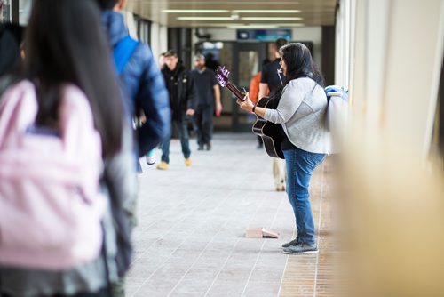 MIKAELA MACKENZIE / WINNIPEG FREE PRESS
Inuit musician Anita Issaluk plays guitar, harmonica, and sings in the skywalks downtown in Winnipeg on Wednesday, Feb. 27, 2019.
Winnipeg Free Press 2019.