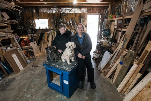 PHIL HOSSACK / WINNIPEG FREE PRESS - Jo-Ann and Lloyd Camire pose with their dogs Louis and Ginger in the workshop that they build dog houses for northern communities. See Aaron Epp's story.   - February 28, 201 9.