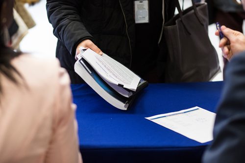 MIKAELA MACKENZIE / WINNIPEG FREE PRESS
City communication staff hand out the 2019 budget to journalists at City Hall in Winnipeg on Friday, March 1, 2019. 
Winnipeg Free Press 2019.