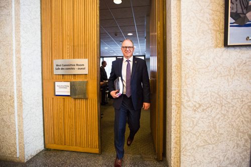 MIKAELA MACKENZIE / WINNIPEG FREE PRESS
Finance chair Scott Gillingham walks out after tabling the 2019 budget at an EPC meeting at City Hall in Winnipeg on Friday, March 1, 2019. 
Winnipeg Free Press 2019.