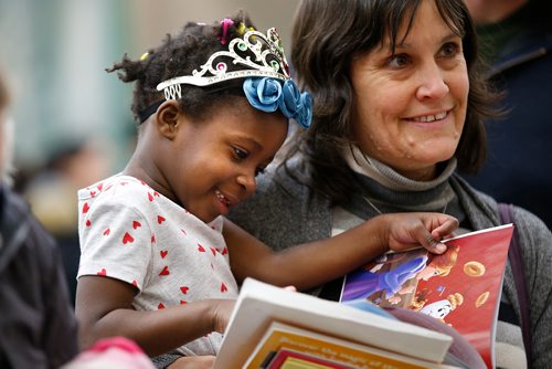 JOHN WOODS / WINNIPEG FREE PRESS
Allison (did not want last name used) and her daughter Taicha read Curious George and other books at the Share the Magic Family Literacy Fun Day at Lord Roberts Community Centre Sunday, March 3, 2019. The fun day was held to celebrate that 21,726 books were given away free to children in Manitoba throughout February, I Love To Read Month, by 23 Manitoba pediatricians.