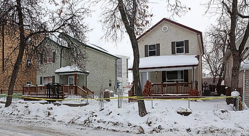 MIKE DEAL / WINNIPEG FREE PRESS
Police at the scene of a critical incident on McGee Street Monday morning. Police tape surrounds two houses in the 700 block of McGee close to Notre Dame Avenue where police have been since Sunday evening. 
190304 - Monday, March 4, 2019