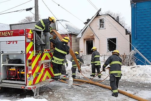 MIKE DEAL / WINNIPEG FREE PRESS
Winnipeg Firefighters clean up after battling a house fire in the 900 block of Alexander Ave Tuesday morning. 
190305 - Tuesday, March 5, 2019