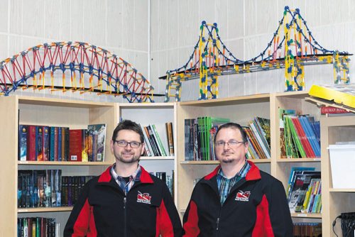 Canstar Community News Manuel Maendel, left, and his brother Paul sport their diving crew jackets in Pauls classroom on Jan. 17. Both brothers work at Albright School in Morris full-time and volunteer on the HEART dive team./PICHÉ