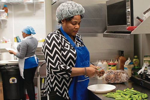 Canstar Community News Feb. 27 - Elizabeth Lawal owns three businesses on Sargent Avenue, her most recent is a West African eatery. (EVA WASNEY/CANSTAR COMMUNITY NEWS/METRO)