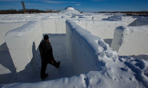 MIKE DEAL / WINNIPEG FREE PRESS
Jordan Dyck, an employee at A Maze In Corn, hauls some wood to one of the fire pits as he prepares for the coming weekend. Recently it was released that Guinness World Records declared the snow maze is the largest snow maze (at) 2,789.11 m² (30,021 ft² 110 in²) and was created by A Maze in Corn, Inc (Canada) in St. Adolphe, Manitoba, Canada, and measured on 10 February 2019."
190305 - Tuesday, March 05, 2019.