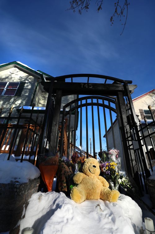 RUTH BONNEVILLE / WINNIPEG FREE PRESS

LOCAL - A memorial of flowers and a teddy bear sit on the steps  to the gate of home at 745 McGee St. where 17-year-old Jamie Adao was murdered during a home invasion Sunday night. 



March 05, 2019
