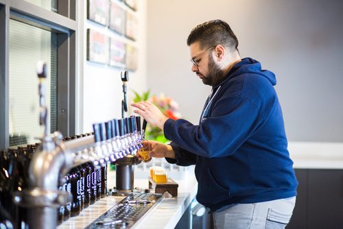 MIKAELA MACKENZIE / WINNIPEG FREE PRESS
Andrew Sookram, who's opening a new brewery called Sookram's, pours a flight of beers in the taproom in Winnipeg on Wednesday, March 6, 2019. 
Winnipeg Free Press 2019.