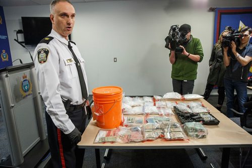 MIKE DEAL / WINNIPEG FREE PRESS
Winnipeg Police Max Waddell Inspector in charge of organized crime division shows off drugs (2 kilograms of cocaine), $215,000 in cash, and a .45 cal handgun as well as other drug dealing material that was seized recently during a couple of raids in the Bridgwater Forest and Garden City neighbourhoods.
190306 - Wednesday, March 06, 2019.