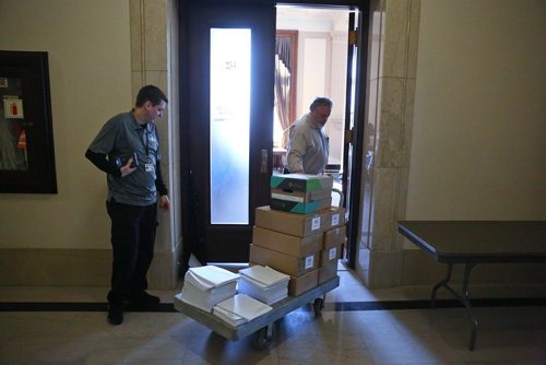 MIKE DEAL / WINNIPEG FREE PRESS
Staff wheel the 2019 Provincial Budget documents into the Media Lockup room early Thursday morning prior to the start of a big day at the Manitoba Legislative building. The 2019 Provincial Budget will be tabled around 2:30 p.m..
190307 - Thursday, March 7, 2019