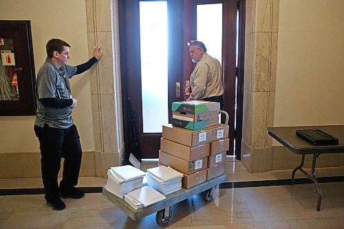MIKE DEAL / WINNIPEG FREE PRESS
Staff wheel the 2019 Provincial Budget documents into the Media Lockup room early Thursday morning prior to the start of a big day at the Manitoba Legislative building. The 2019 Provincial Budget will be tabled around 2:30 p.m..
190307 - Thursday, March 7, 2019