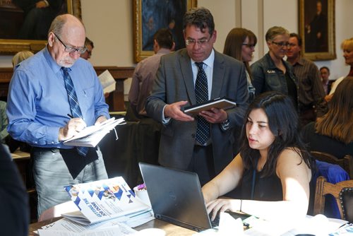 MIKE DEAL / WINNIPEG FREE PRESS
Winnipeg Free Press reporters Larry Kusch (left) and Jessica Botelho-Urbanski (right) read and discuss the 2019 Provincial Budget documents during the Media Lockup prior to the tabling of the budget in the Manitoba Legislative Chamber Thursday.
190307 - Thursday, March 07, 2019.